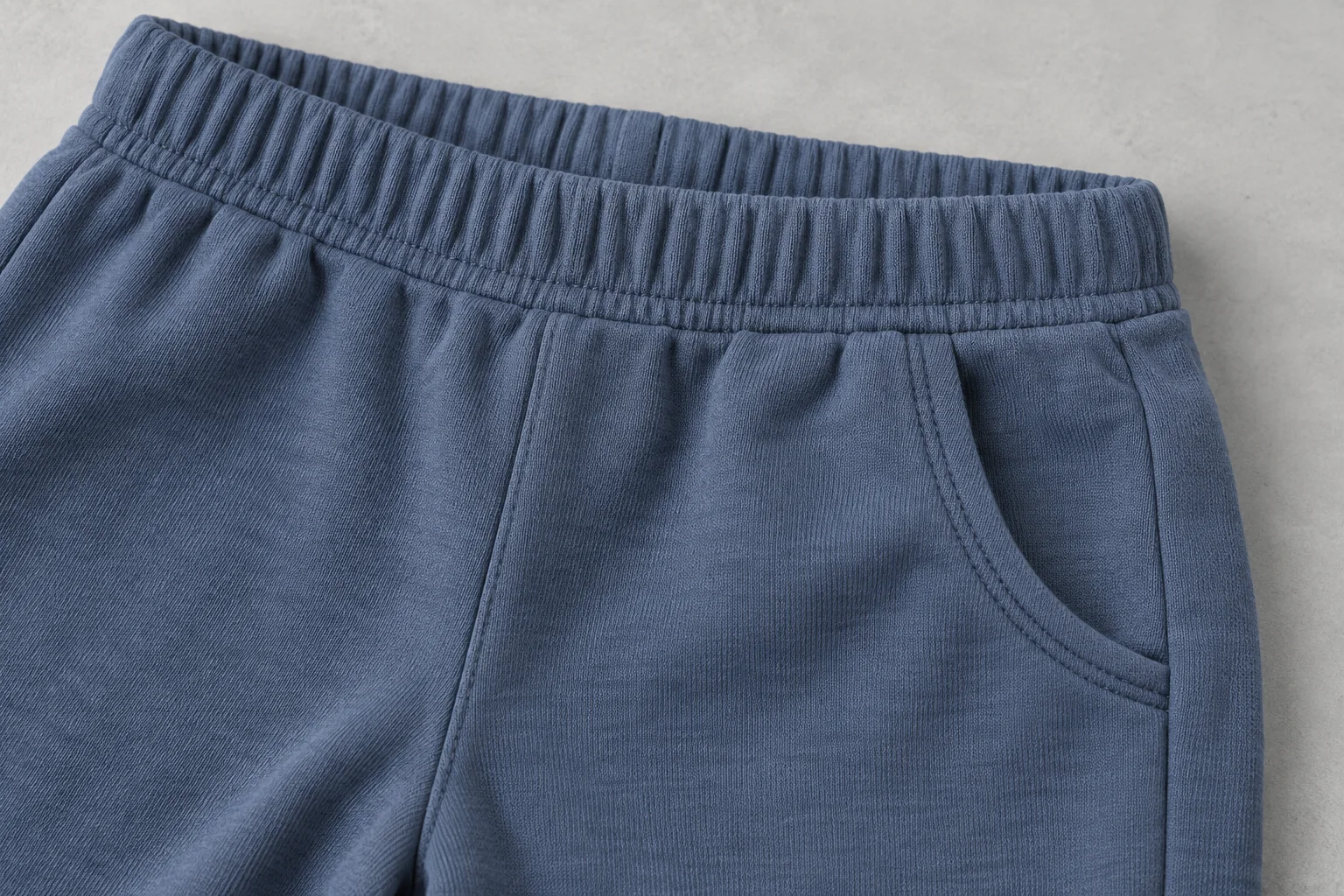 AI construction illustration of an enclosed waistband and pocket on knit pants; not Tianyi workmanship or a sample